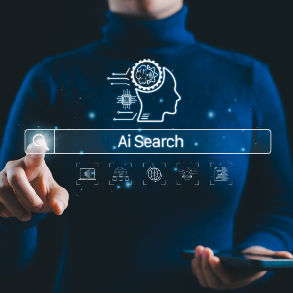 AI Search Interface and Smart Technology Concept. A person interacts with AI search bar and digital icon, machine learning, data networks, and global connectivity, symbolizing smart search technology.
