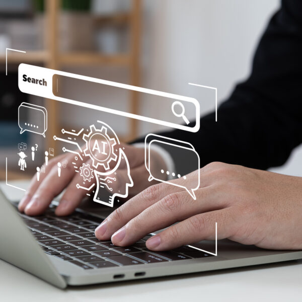 Modern website on laptop with AI graphics showing how artificial intelligence is changing marketing and search online