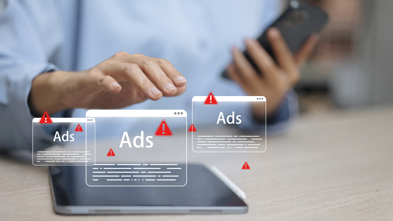 Digital marketer scrolling on devices as intrusive ad alerts pop up, symbolizing the uncertainty and risk around new ChatGPT advertising.